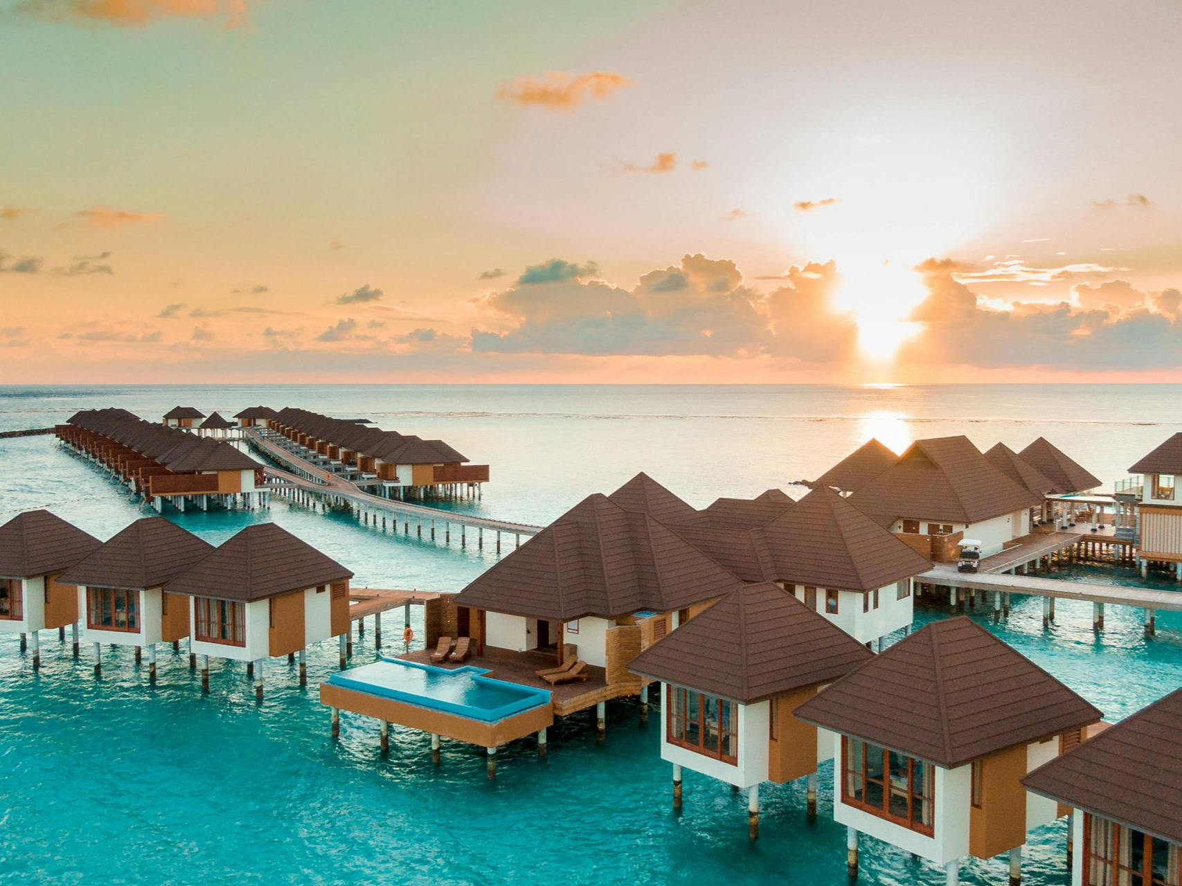 Overwater bungalows at sunset