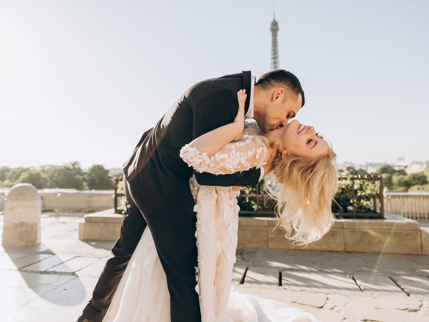 Groom dipping bride