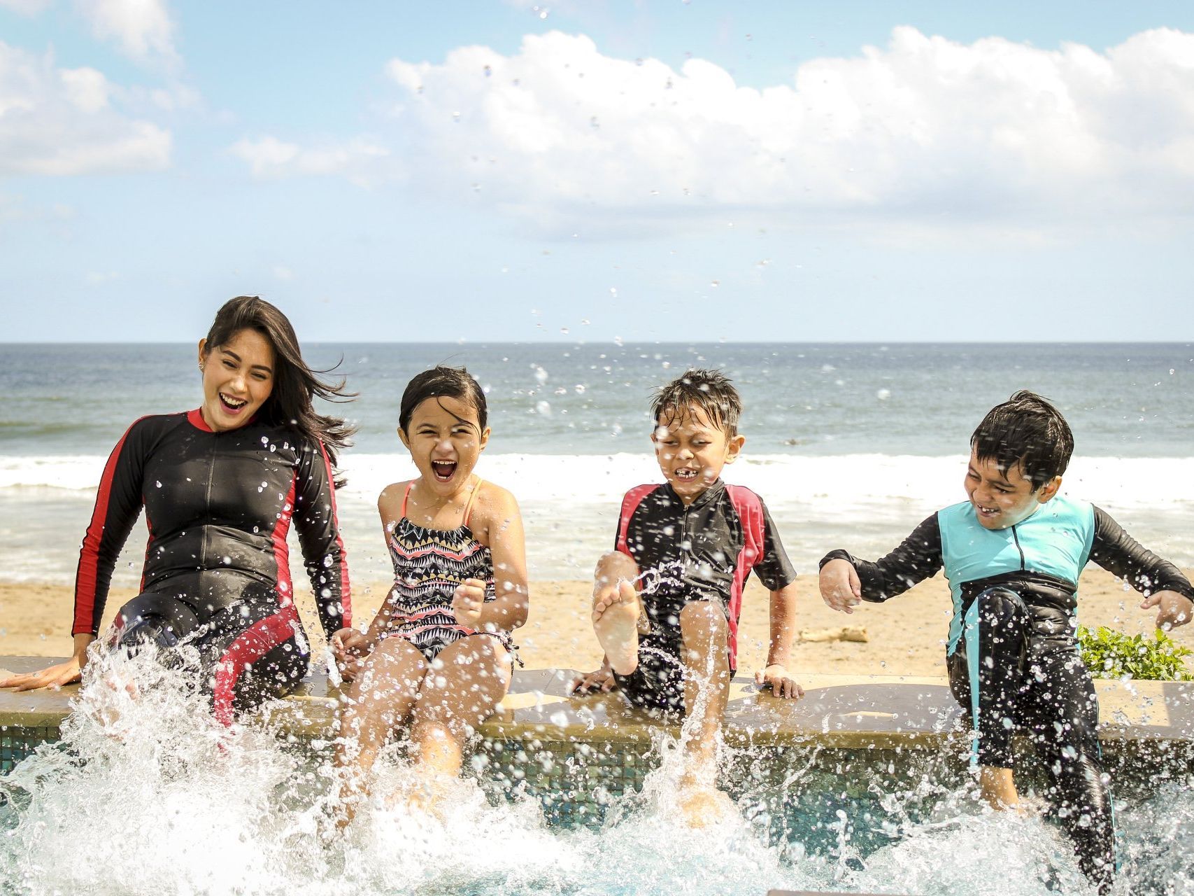 Family splashing in the surf